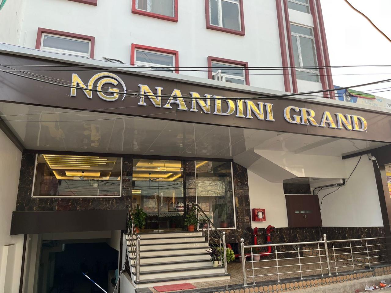 Hotel Nandini Grand exterior with gold NG signage