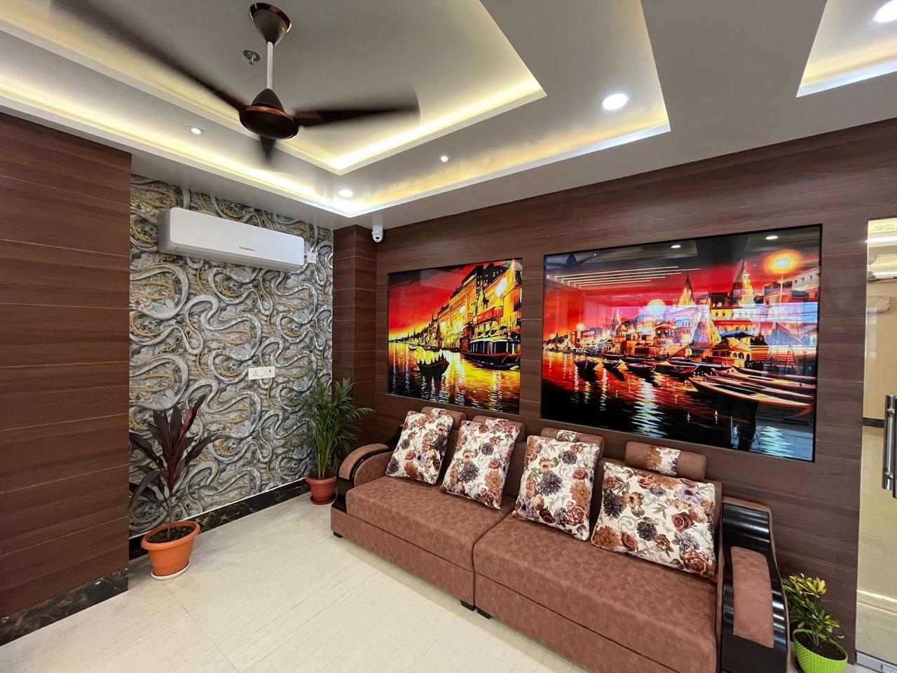 Seating lounge with paintings of the Varanasi ghats